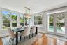 Dining area.  Note the superior amount of natural light in this room and the views of the pool area and side yard landscaping.