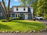 Front of  adorable cottage next door~Virtual landscaping added
