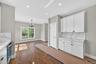 Open space with breakfast area extra cabinetry, counter space and pantry.