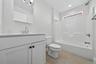 2nd floor full bathroom with a tub.