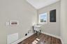 Ceramic tile flooring, window and utility sink.