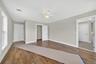 Hardwood flooring and walk-in closet.