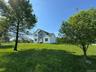View of the house and front yard from the road.