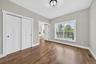Bedroom on 1st floor. Sunny spacious with 9' high ceilings and hardwood flooring.