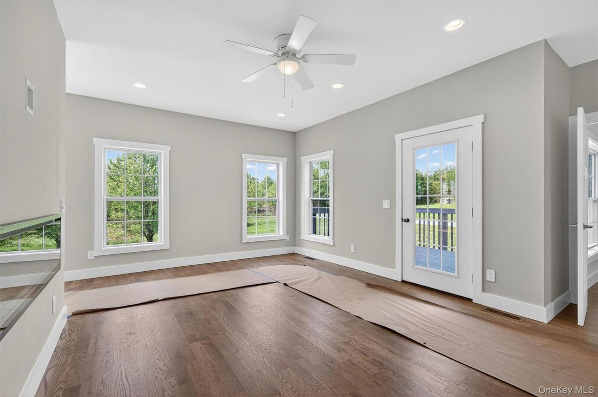 Sunny with views, a door opening to the deck and back/side yard access.