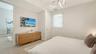Experience R&R in the welcoming bedroom.