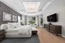The owner’s suite serves as a luxurious private retreat, thoughtfully designed to capture peaceful views and provide seamless access to the outdoor li