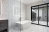 There is a large freestanding soaking tub.