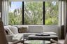 There is an electric shade and custom drapery on the oversized window in the bonus room.
