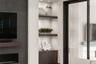 The custom built-in cabinetry and shelving has accent lighting.