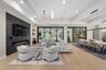 The expansive great room serves as a stunning focal point for the home with soaring 13-foot ceilings.