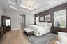 There are dual walk-in closets outfitted with extensive custom cabinetry and shelving provide exceptional organization and storage.