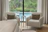 The spacious primary suite has plenty of room for relaxation after a day on the boat or at the pool!