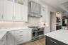The kitchen is flooded with natural light and views of the pool!