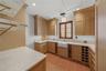 BUTLER'S PARLOR WITH SUB-ZERO REFRIGERATOR, MIELE MICROWAVE, MIELE COFFEE SYSTEM BUILT IN, STAND ALONE BEVERAGE REFRIGERATOR AND STAND ALONE ICE MACHI