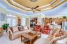 Triple tray ceilings and crown molding adding architectural elegance.