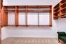 Dual custom walk-in closets offering ample storage.