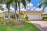 Stylish pavered driveway leading to the home.