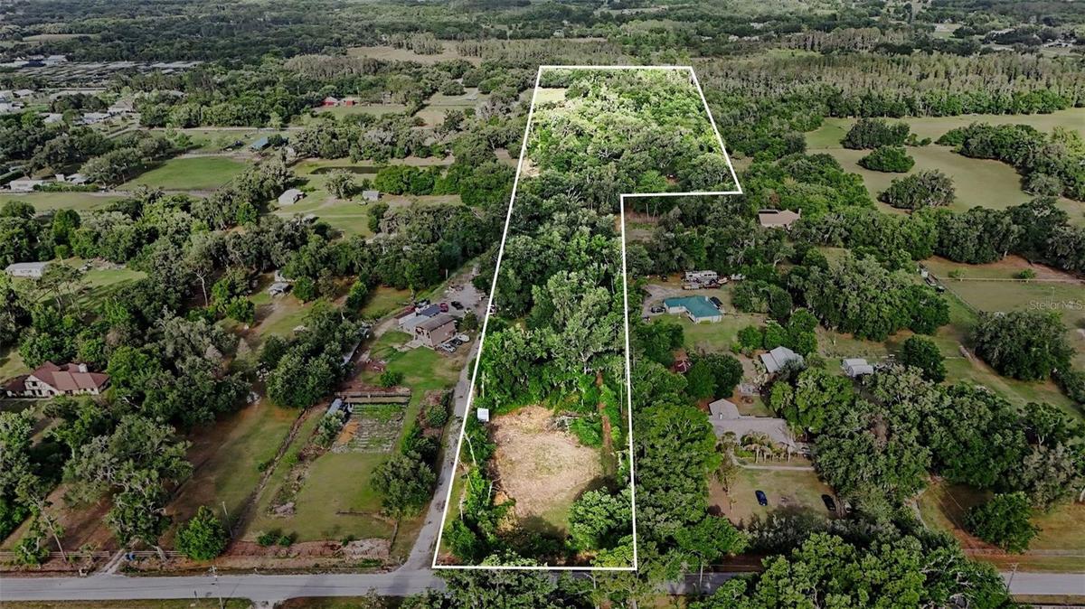 4103 STANLEY & 5.47 ACRES DIRECTLY BEHIND.