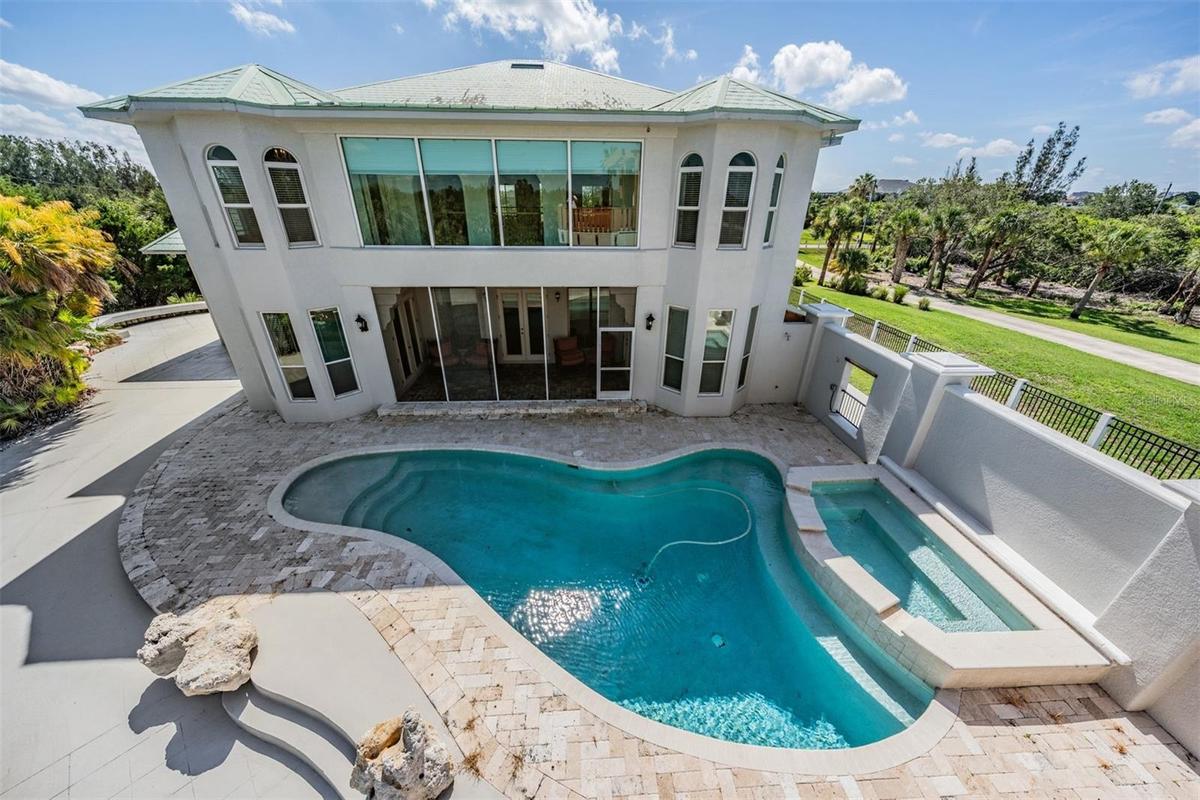 Custom pool and heated Spillover Spa