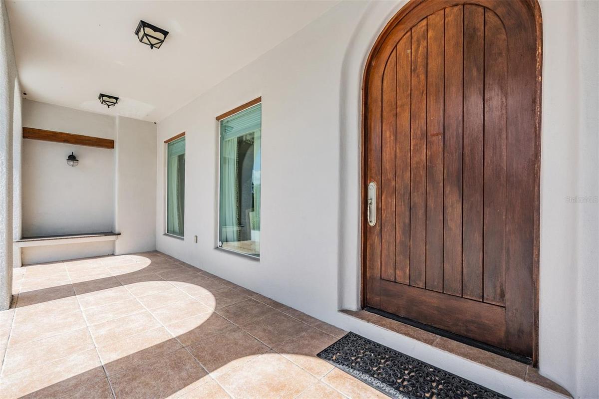 Solid wood Entry door and covered front porch welcome you!