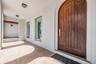 Solid wood Entry door and covered front porch welcome you!