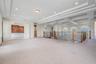 Bonus room loft area with triple tray ceiling and access to balcony overlooing front lawn