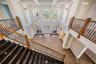 Granite staircase overlooks dramatic Great room