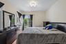 This good size Bedroom, has sliders to a porch & stairs to the lower Patio.