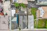 A aerial view of 34 Cedar St & it's 3 neighbors. Give view of the Patio back yard.