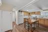 This large Modern Kitchen has lots of counter space,  cabinets & pantry!