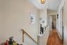 Upper Unit 2 - Hallway to Bedroom in Front of Apartment.