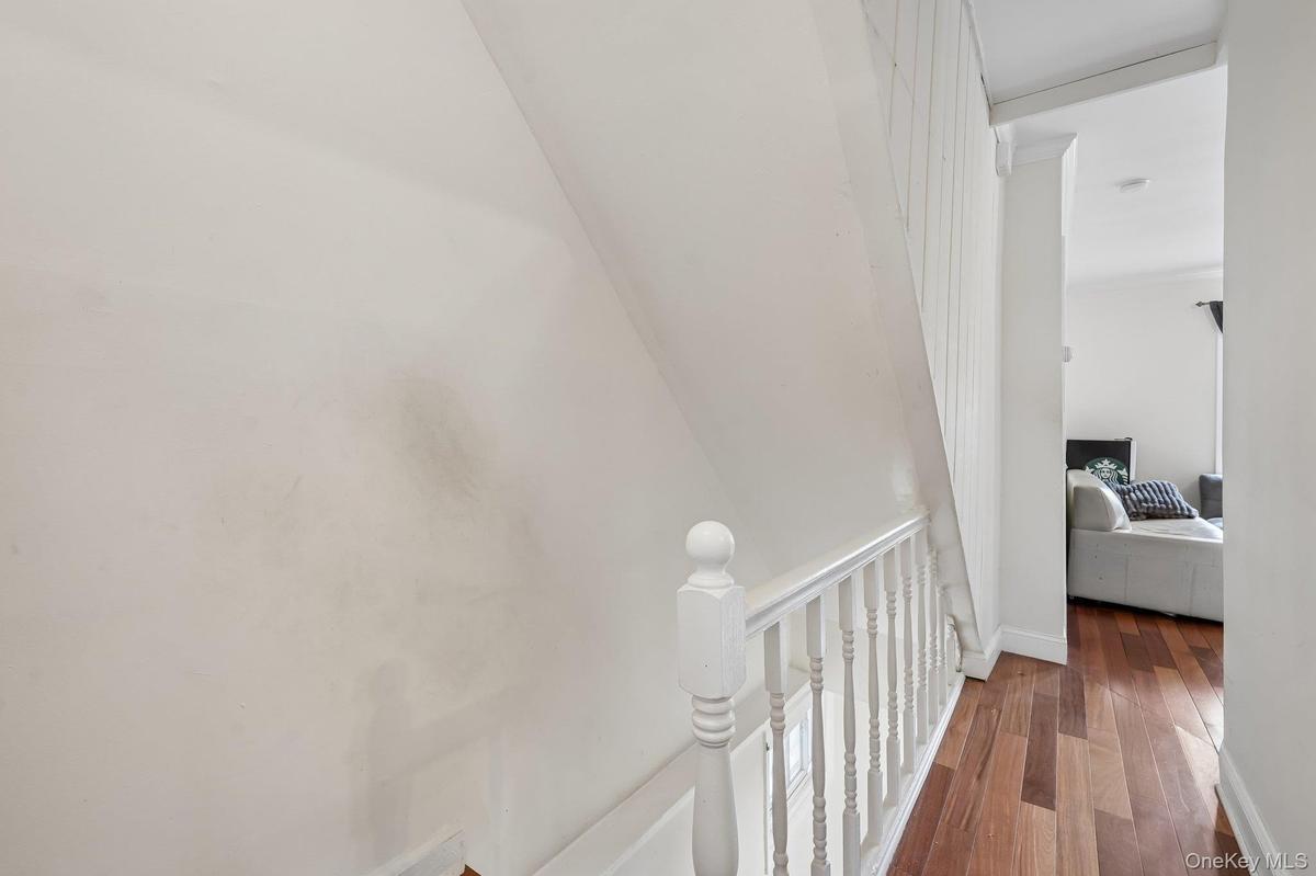 Hallway leads to the Bathroom & Stairs to the lower level of this up-side-down-unit!