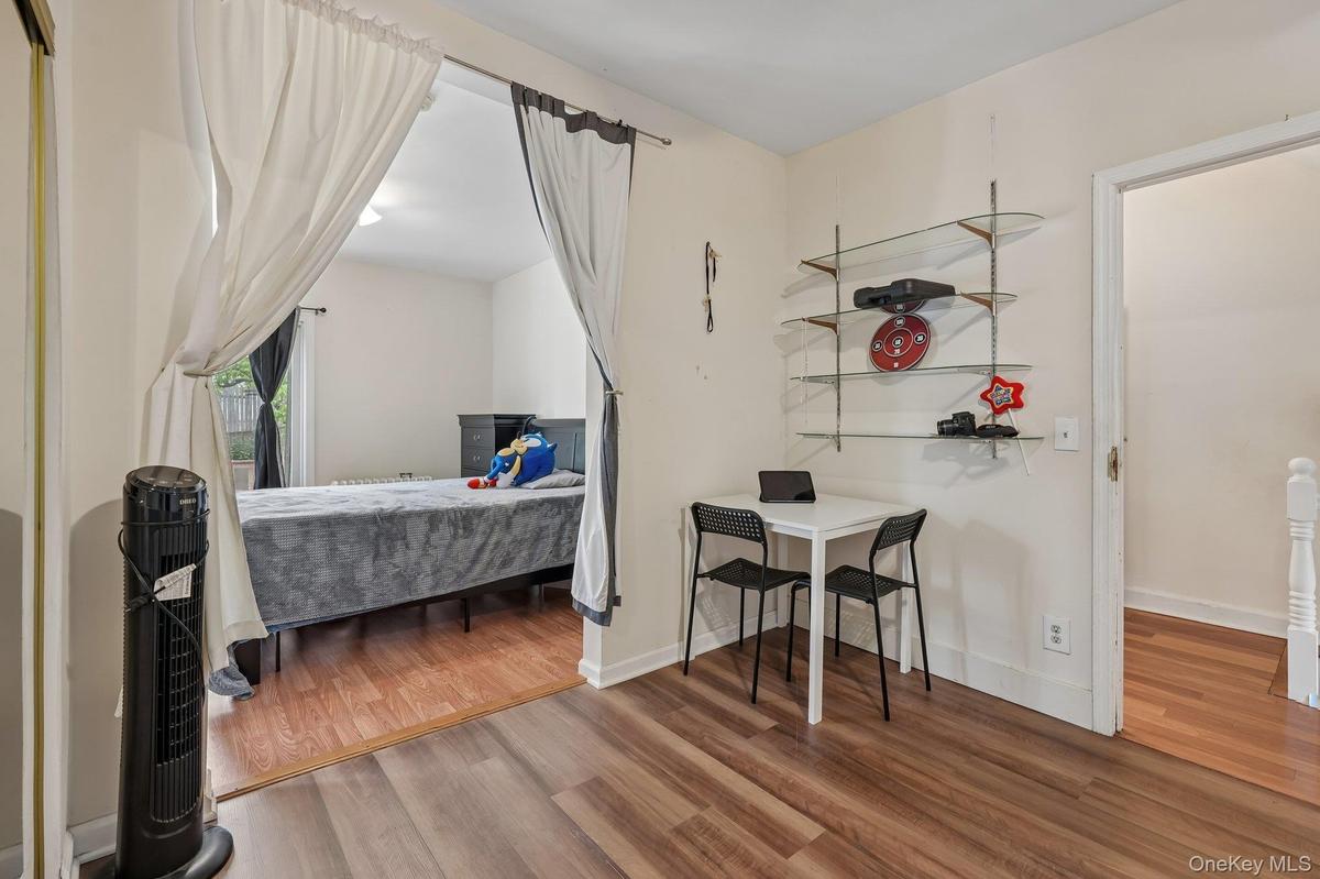 This Bonus room opens to the Primary Bedroom. Laminate floor in Den.