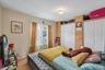 Upper Unit 2 - Bedroom with large Windows & closet,
