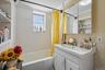 Upper Unit 2 - Full Bathroom with a window.