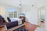 Guest bedroom 1 with large closet, and hardwood flooring