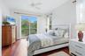Guest bedroom 2 with large closet, and hardwood flooring