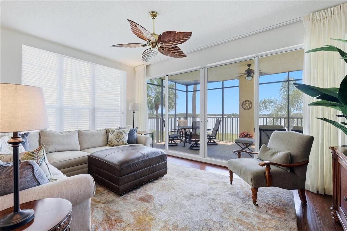 Great room With triple sliders and motorized sliding drapery