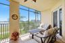 Large Lanai with comfortable chairs and a table