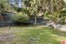 flat yard adjacent to unpaved