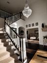 Walk into an Elegant Foyer with New Large Crystal Chandleir, Custom Stair carpet and New Hardwoods and New Front Foor