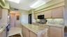 LAUNDRY ROOM BEHIND DOOR AT ENTRY OF KITCHEN