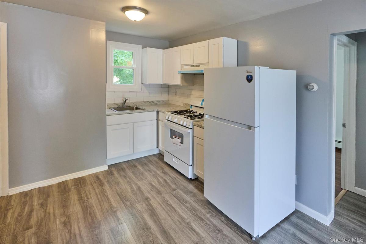 Kitchen with new appliances (Unit 1)