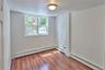 Bedroom with laminate wood floor (Unit 1)