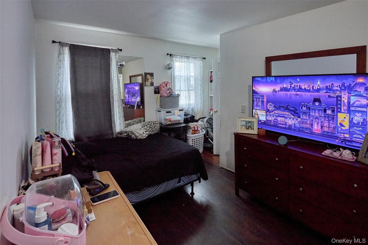 Spacious living room with stairs to attic (Unit 2)