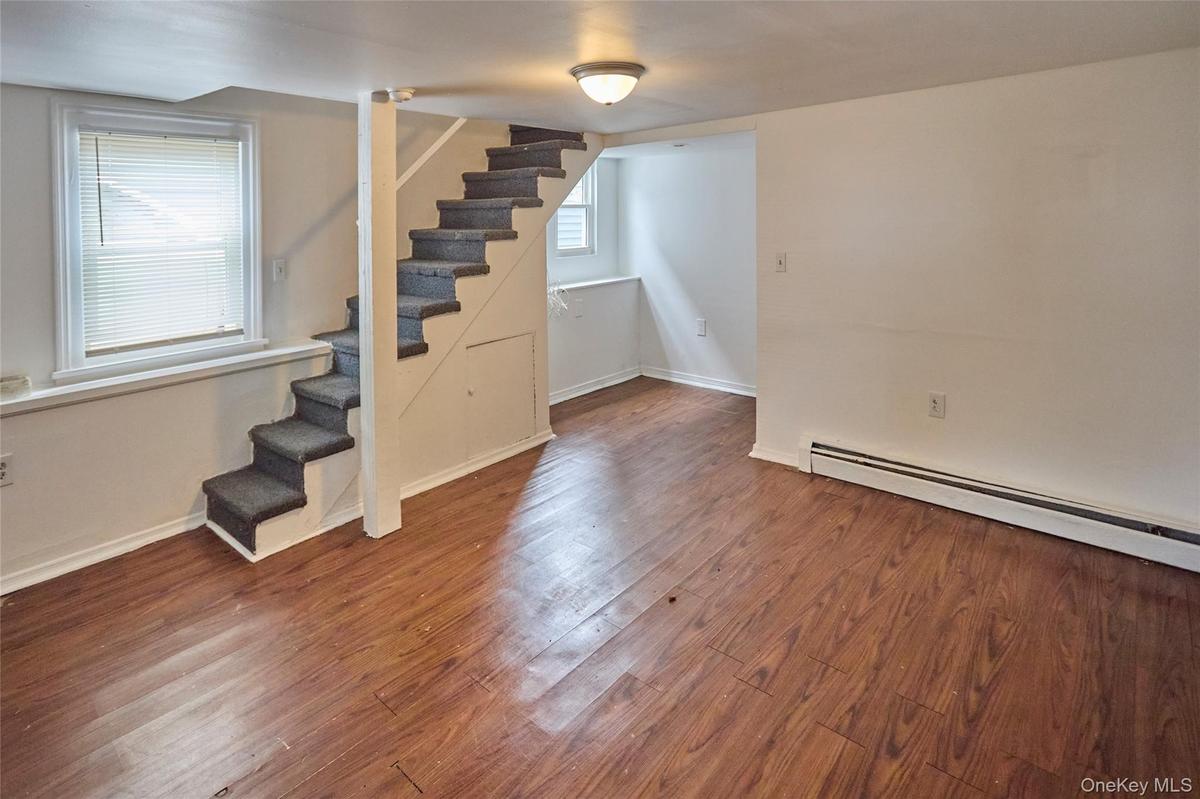 Large lower level living room with separate entrance (Unit 1)