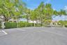 Meticulously-maintained landscaping surrounds the grounds and ample guest parking areas.