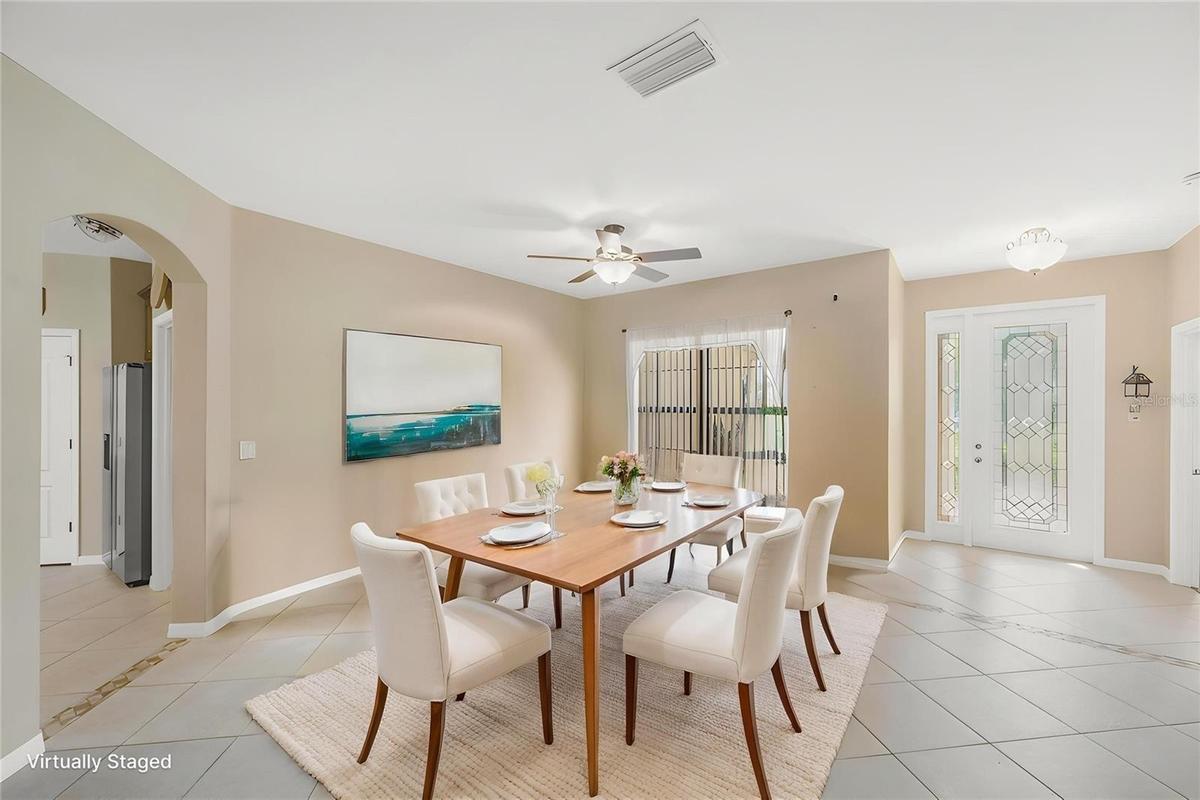 Just beyond the beautiful leaded glass front door with sidelight is the Dining/Living room area.