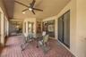 The spacious 32' x 15' covered and screened lanai can be accessed through sliding doors from the family room, living room, and primary suite, creating